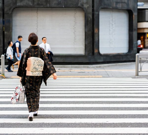 japanese woman is crossing road wearing japanese traditional dre
