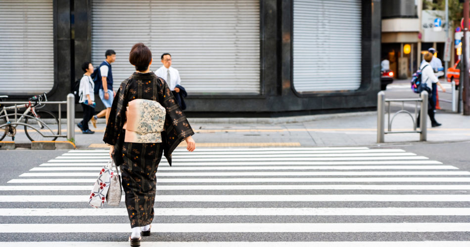 japanese woman is crossing road wearing japanese traditional dre